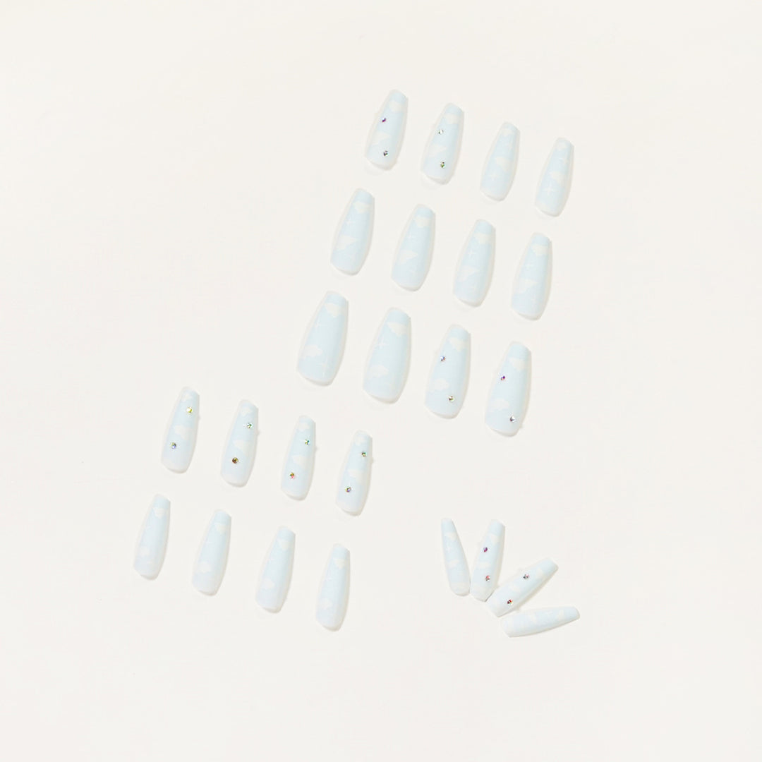 Creative nail art in cloud design with glitter accents Stornfield