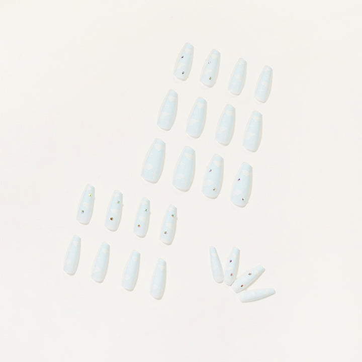 Creative nail art in cloud design with glitter accents Stornfield