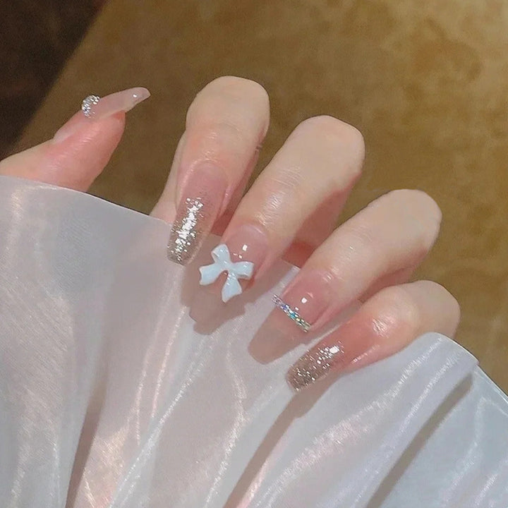 Glamorous artificial nails with heart-shaped accents Stornfield