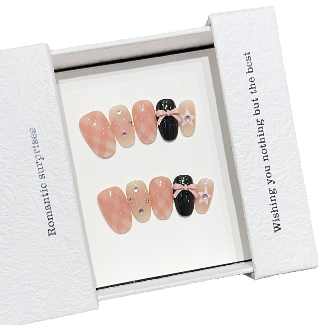 Artificial nails with romantic design and glitter details Stornfield