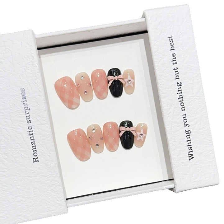 Artificial nails with romantic design and glitter details Stornfield