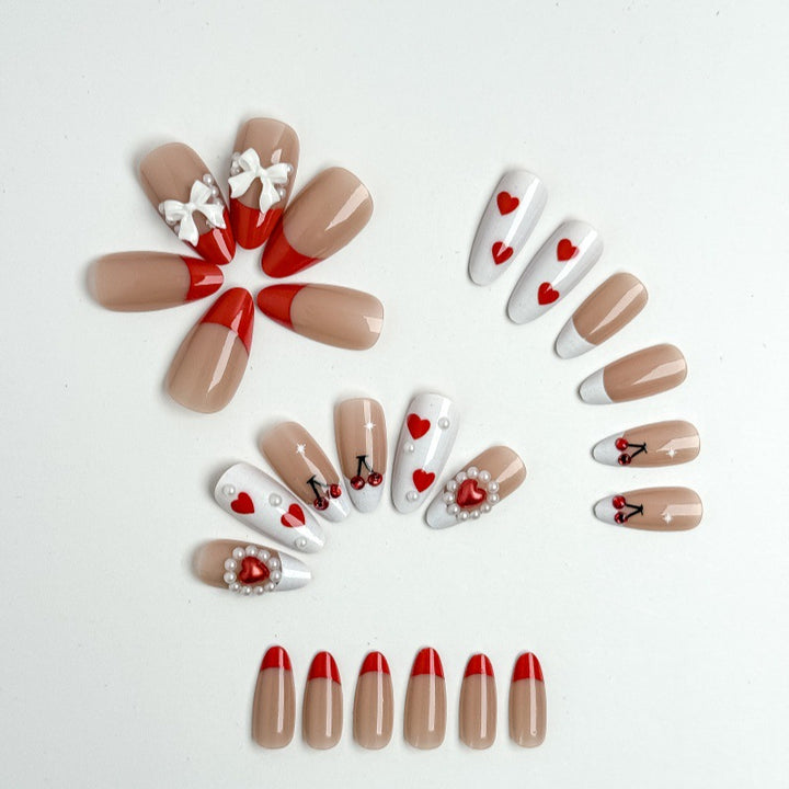 Creative nail art with heart and cherry motifs Stornfield