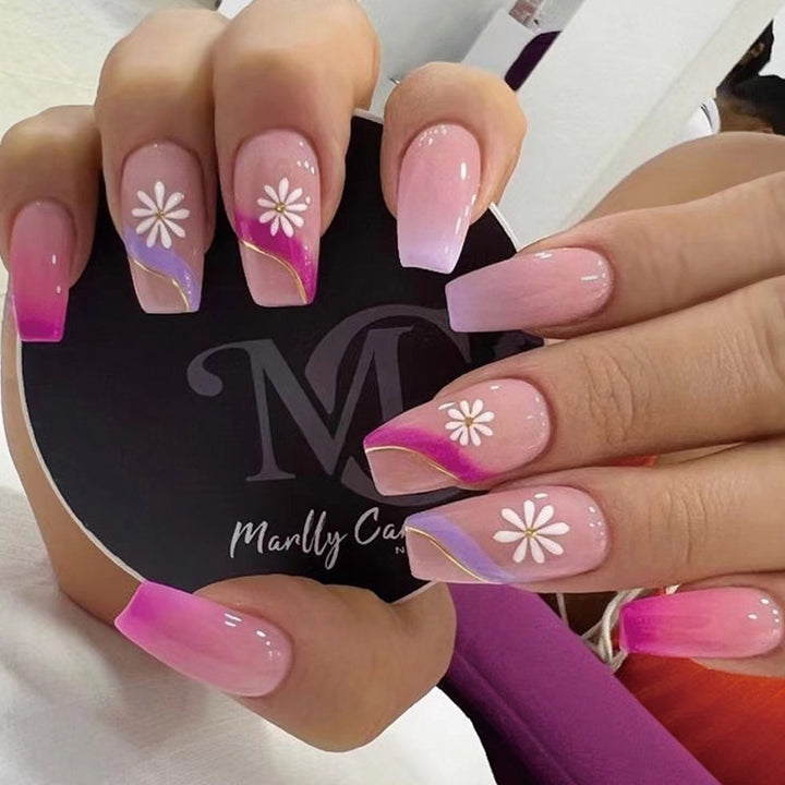 Artful nail extensions with colorful ombre design and floral accents Stornfield