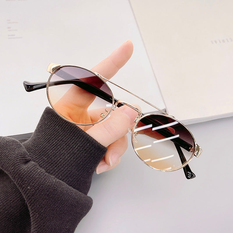 Ladies fashionable sunglasses in stylish round design with golden accents Stornfield