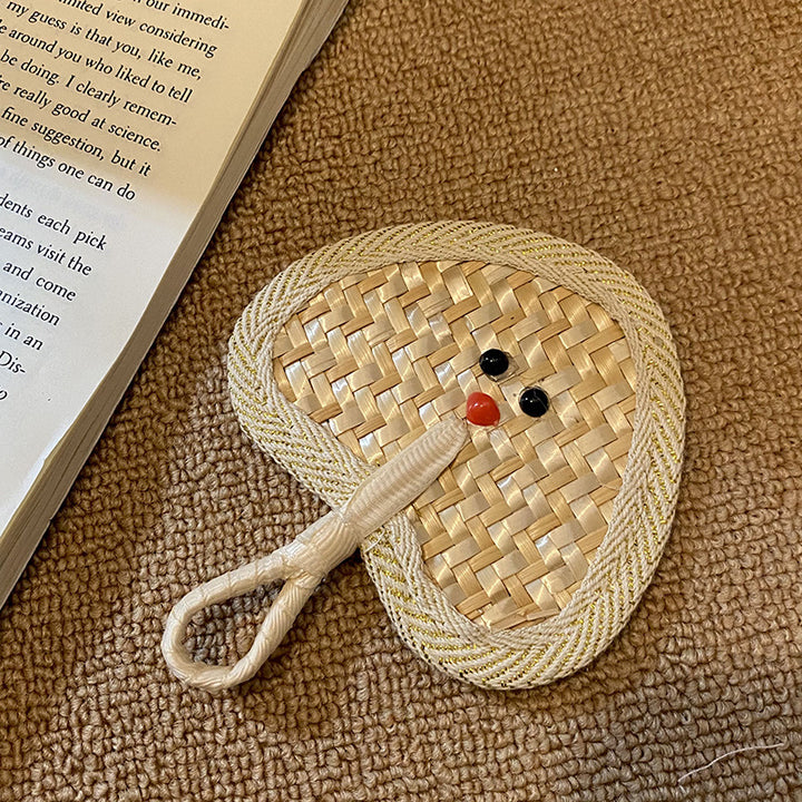Handcrafted fan with playful face motif Stornfield