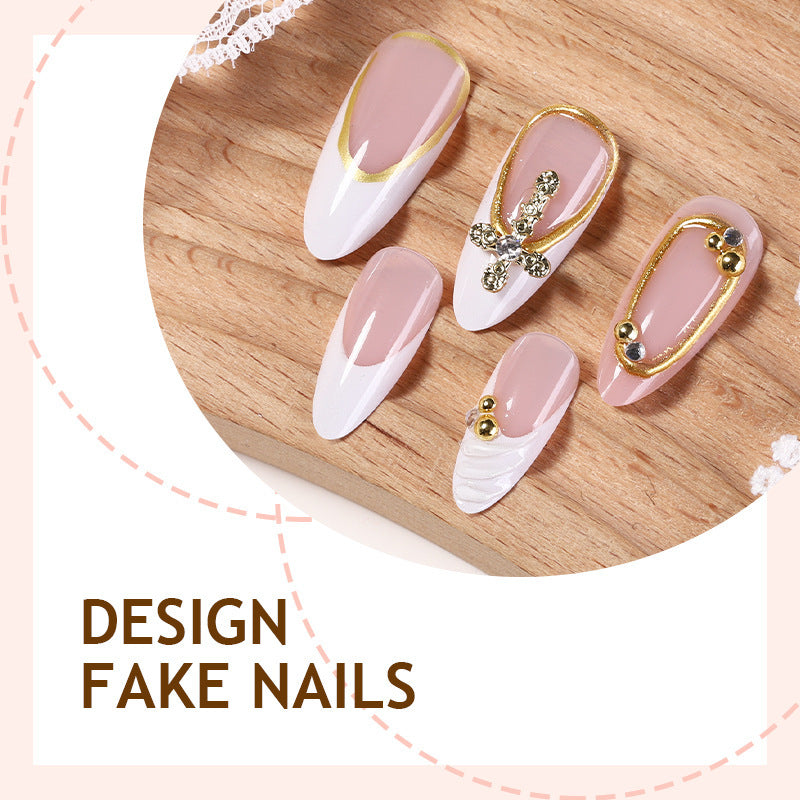 Artificial nail set with luxurious gold embellishments and elegant designs Stornfield