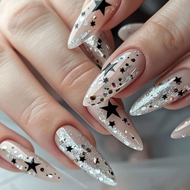 Artistic stiletto nails with glitter and star design Stornfield