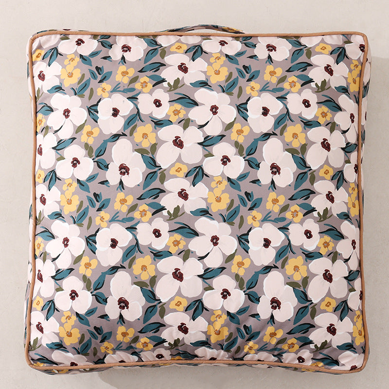Large decorative seat and floor cushion with floral pattern