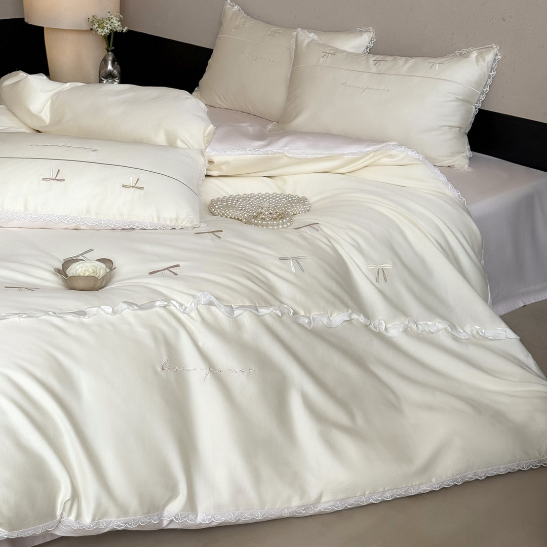 Elegant bedding set made of silky fine satin with embroidered bows and lace trim