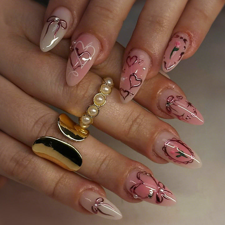 Artificial nail set with romantic hearts and bows design Stornfield