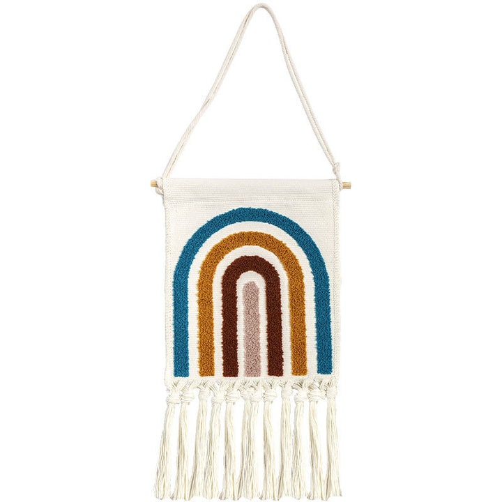 Hand-tufted wall hanging made of cotton with rainbow motif and fringes