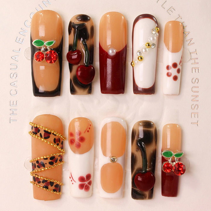 Nail art set with luxurious cherry and glitter accents Stornfield