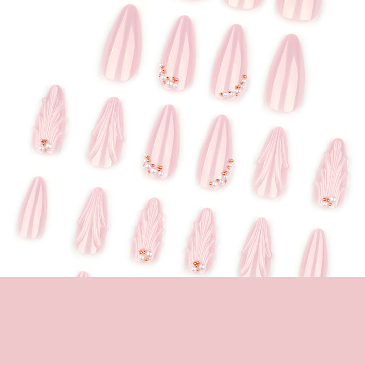 Elegant stiletto nails with shimmer design and pearl decorations Stornfield