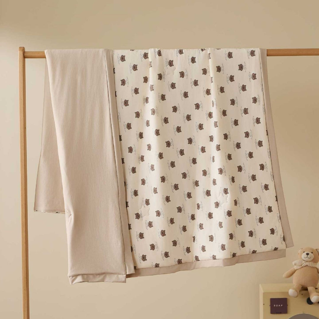 Double-layer baby crawling blanket made of cotton jersey with light padding and delicate all-over animal print