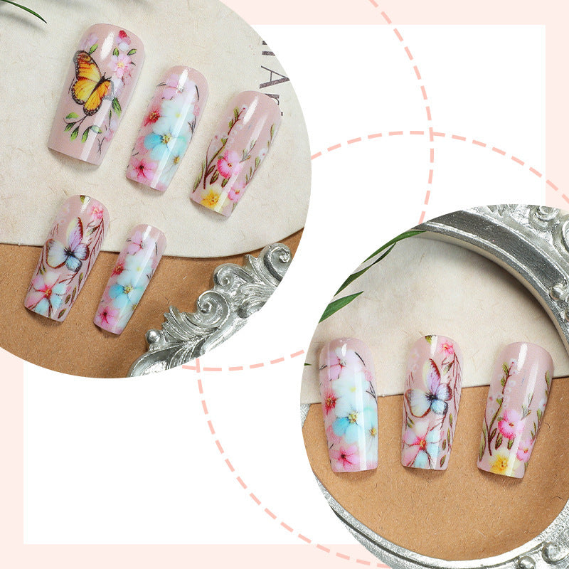 Artificial nail set with floral motifs and butterfly design Stornfield
