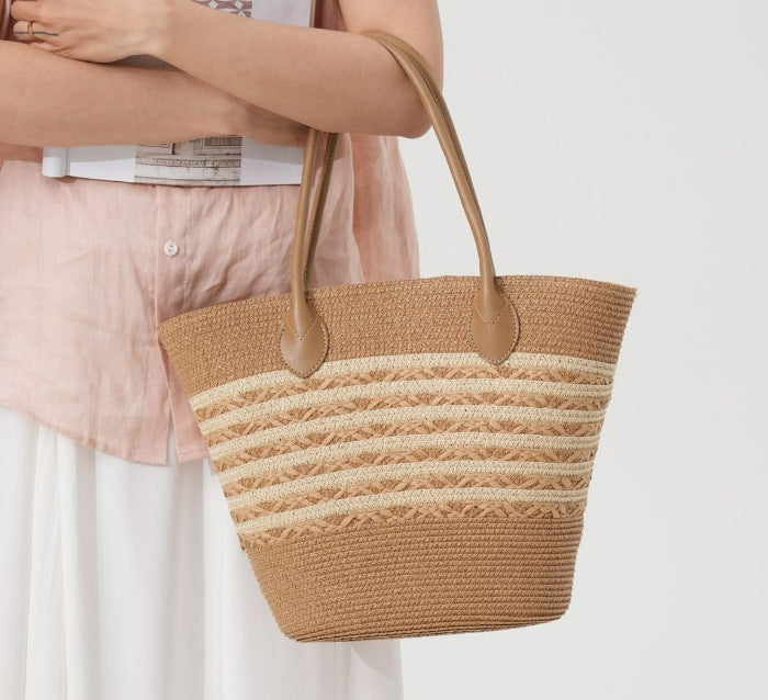 Beach bag made of natural woven material with elegant accents Stornfield