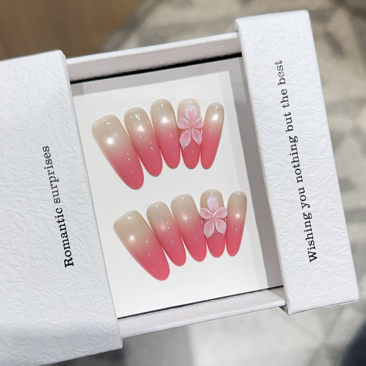 Artificial nails with romantic ombre design and floral accents Stornfield