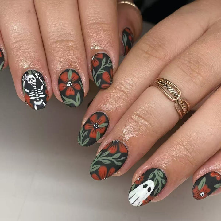 Acrylic nail set with creepy Halloween designs and floral accents Stornfield