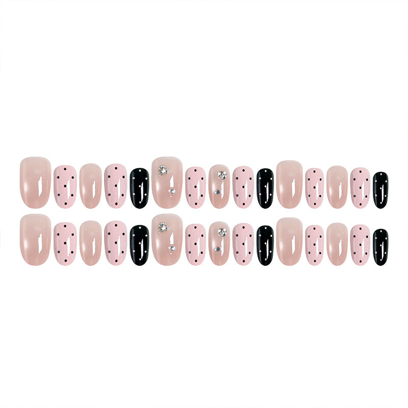 Acrylic nail set with glamorous rhinestone accents and modern dots Stornfield