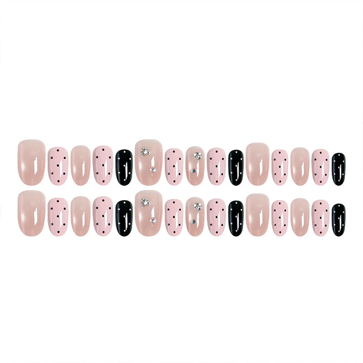 Acrylic nail set with glamorous rhinestone accents and modern dots Stornfield