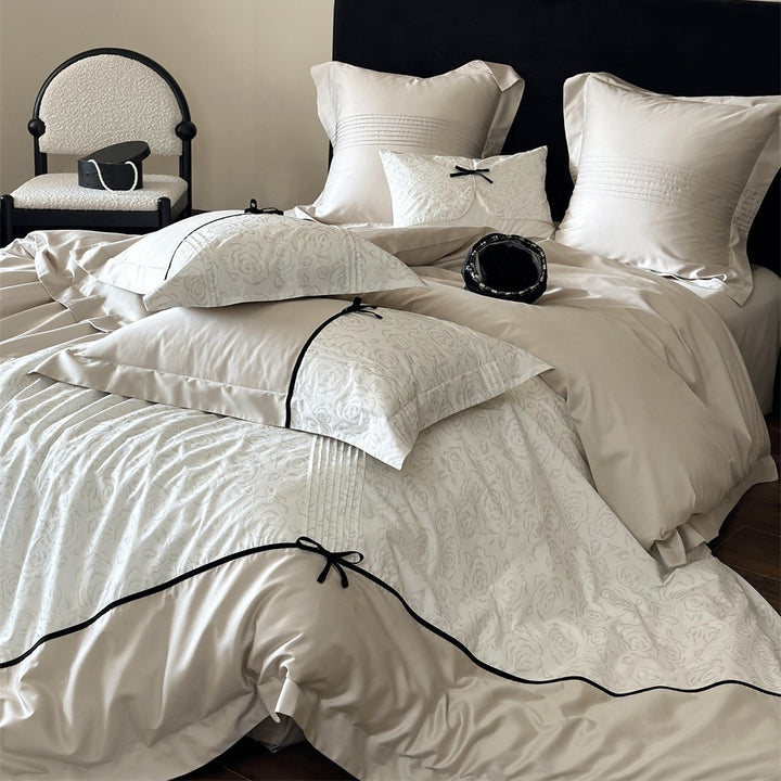 Reversible Duvet Cover Bedding Set with Quilted Jacquard Panel, Black Piped Trim & Decorative Bow Shams