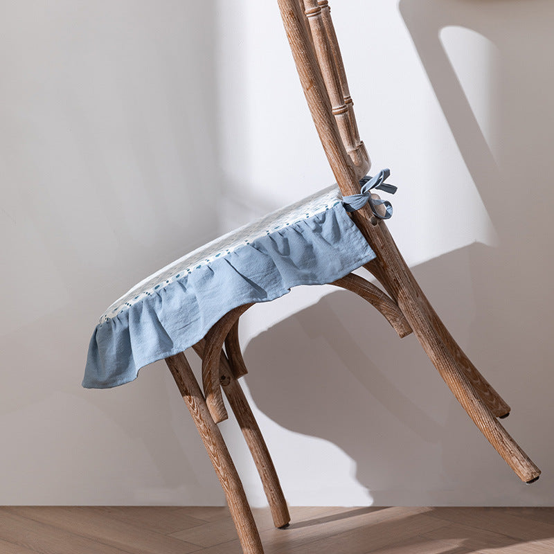Padded chair seat cushion with tie straps and ruffled edge