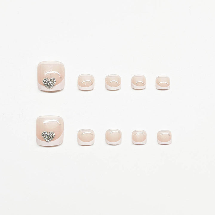 Artifical nail set with glamorous heart design and elegant French tip Stornfield