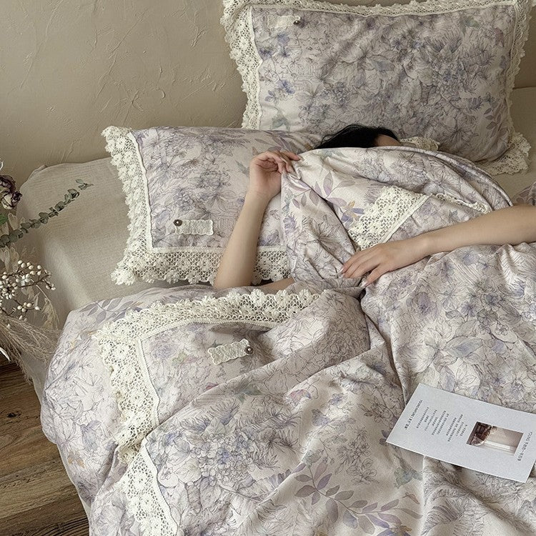 Duvet cover set made of cotton percale with fine lace trim and botanical watercolor pattern