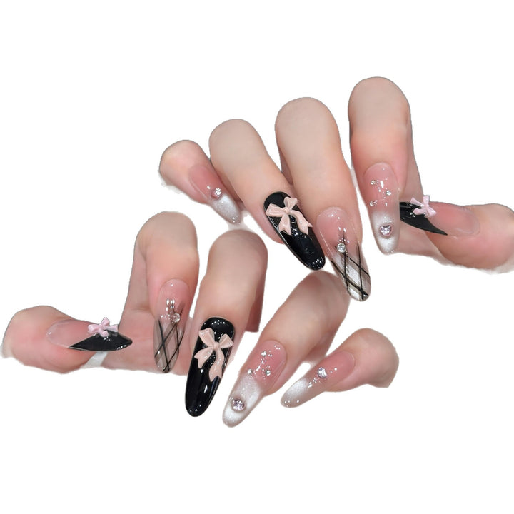 Artificial nail tips with elegant bows and glitter details Stornfield
