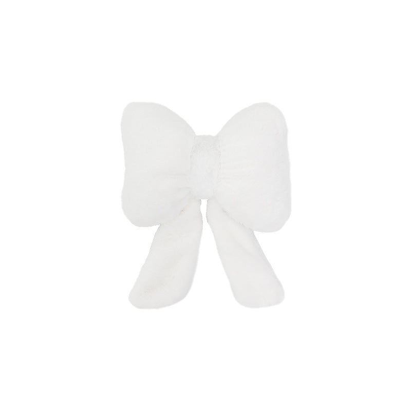 plush bow-shaped decorative throw cushion with long tails and faux-fur texture Stornfield