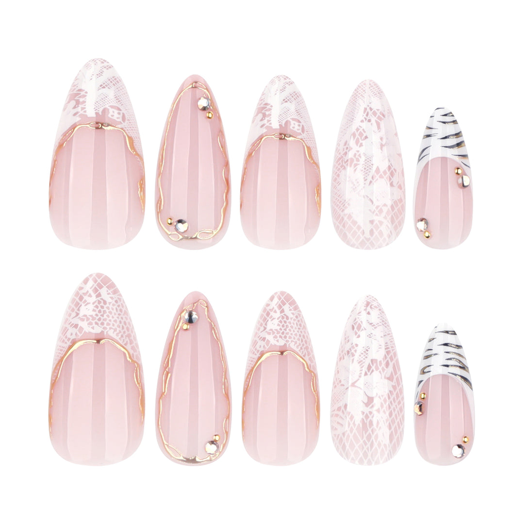 Artful stiletto nails with gold and tip embellishments Stornfield