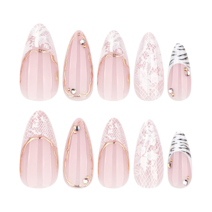 Artful stiletto nails with gold and tip embellishments Stornfield