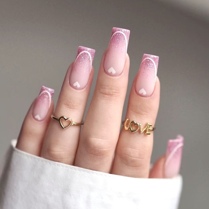 Nail art set with romantic heart designs and glamorous accents Stornfield