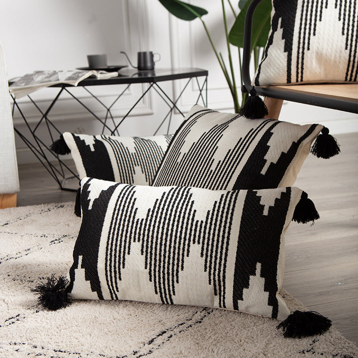 Rectangular Jacquard lumbar cushion cover with geometric ethnic relief and decorative tassels Stornfield