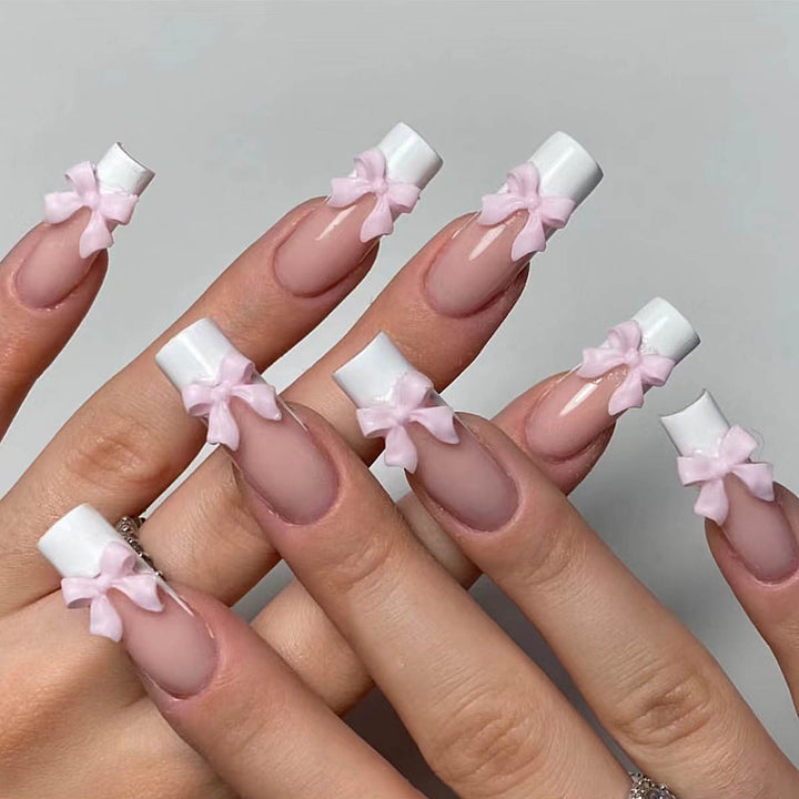 Artificial nails with playful bow design Stornfield