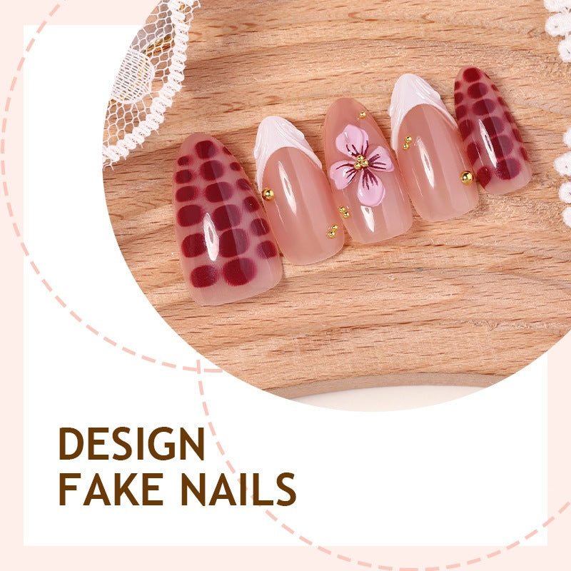 Artificial nail set with exciting flower and glitter designs Stornfield