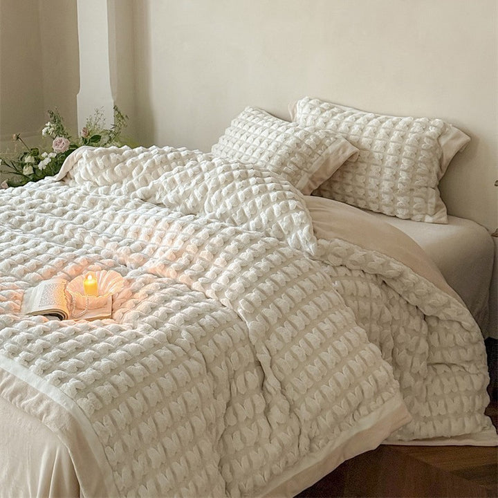 Quilted velvet bedding set with 3D waffle structure and decorative border Stornfield