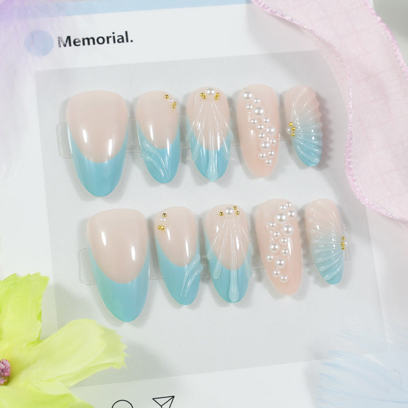Art nail set with elegant shell and pearl decorations Stornfield