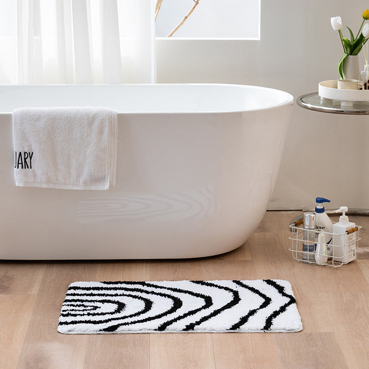 Fluffy bath mat with abstract wave pattern and non-slip back