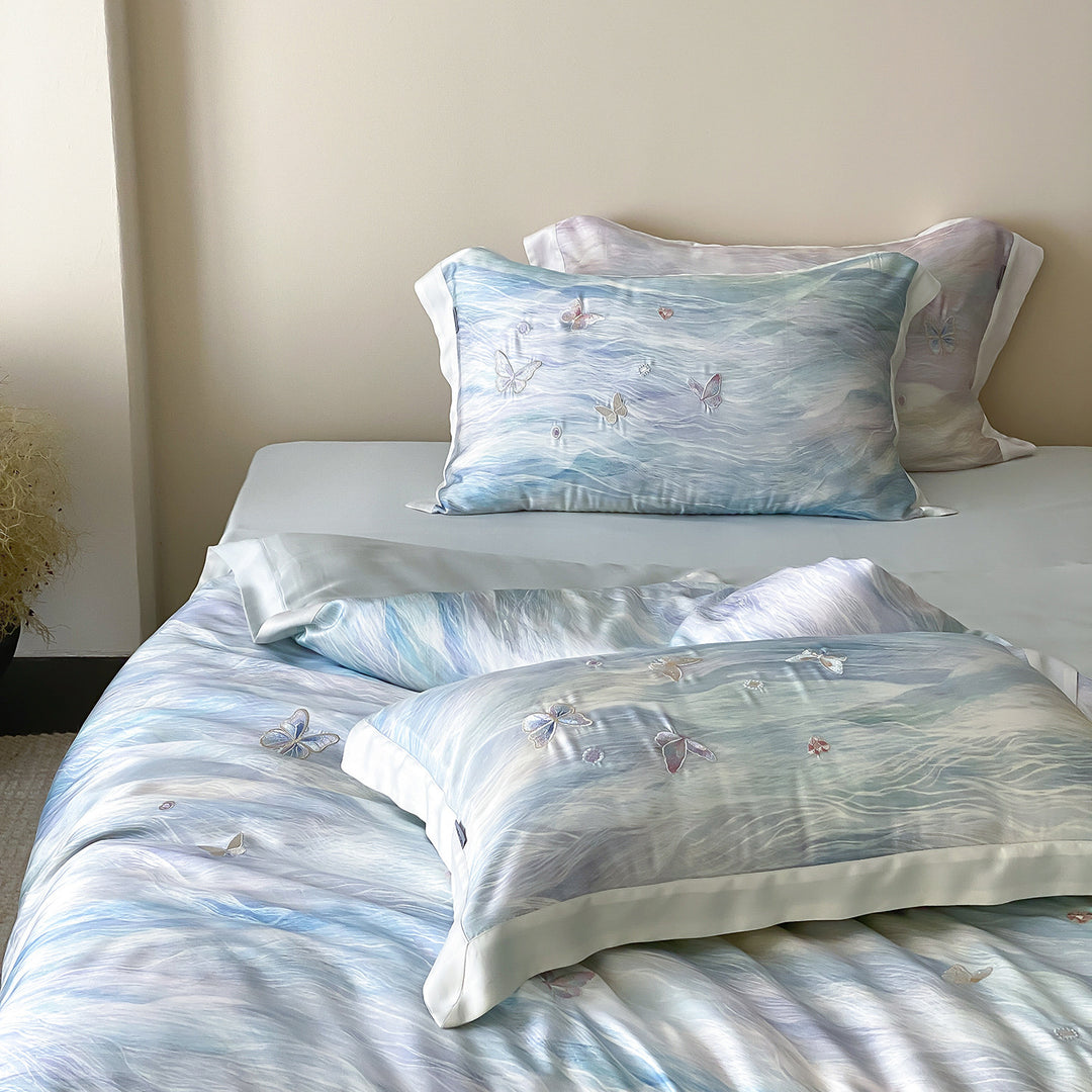 Elegant satin bedding set with watercolored gradient and 3D butterfly embroidery