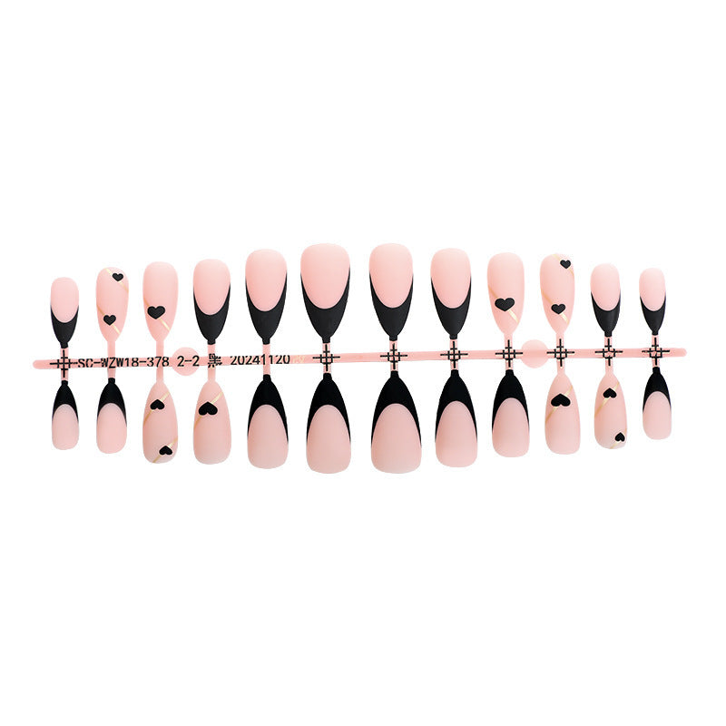 Creative nail art set with heart-shaped accents and elegant French tips Stornfield