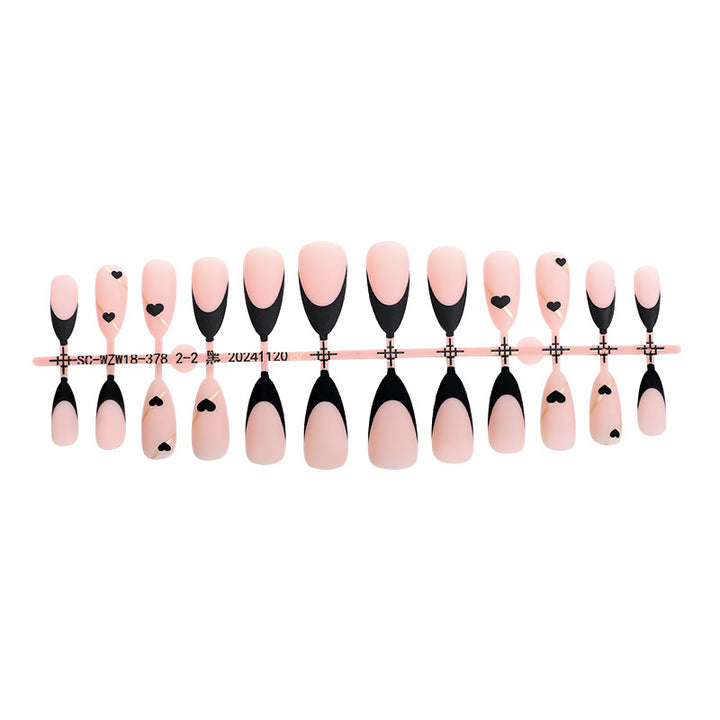 Creative nail art set with heart-shaped accents and elegant French tips Stornfield