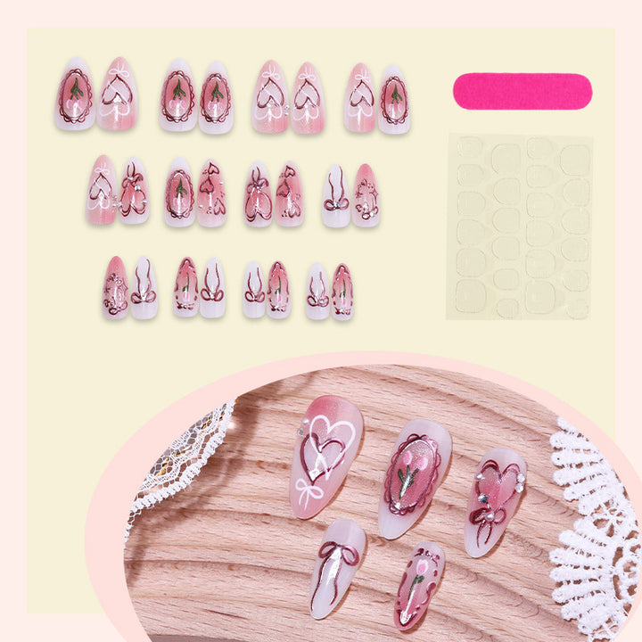 Artificial nail set with romantic hearts and bows design Stornfield