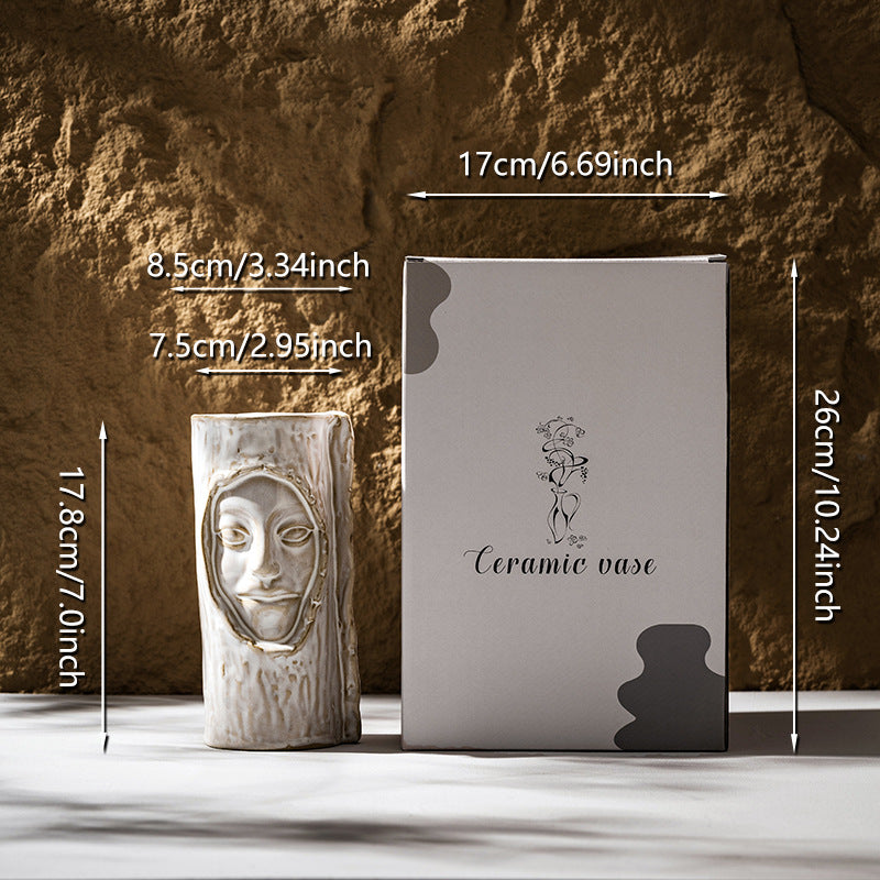 Handmade ceramic sculptural face-stem cylindrical flower pot with textured glaze