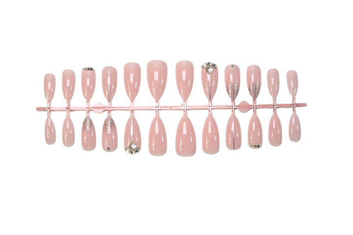 Glamorous artificial nails with rhinestone accents and shimmering effects Stornfield