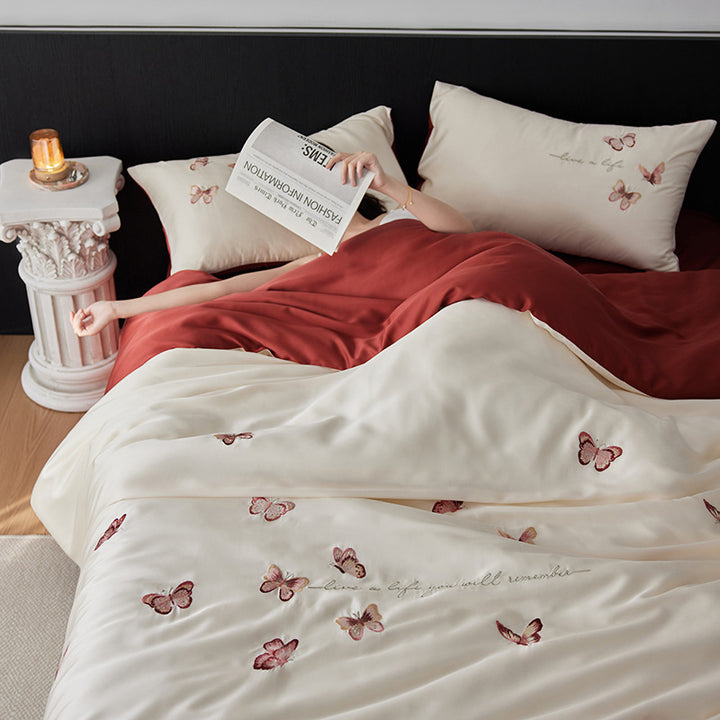 Luxurious cotton satin duvet cover set with embroidered butterfly designs and reversible design