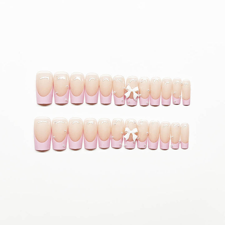Artificial nail set with romantic bow and pearl embellishments Stornfield