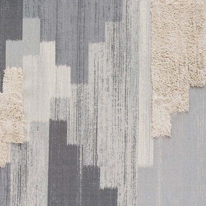 Modern woven living room rug with abstract structure and tufted high-pile accents Stornfield