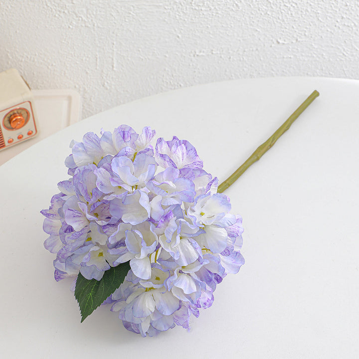 Artificial flower branch with realistic flowers