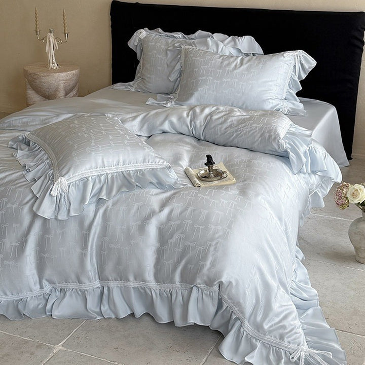 Satin bedding set with jacquard bow relief, gathered ruffle and lace trim